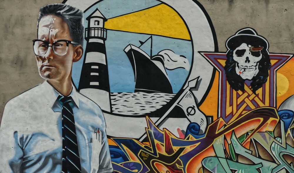 man in blue dress shirt wearing black framed eyeglasses