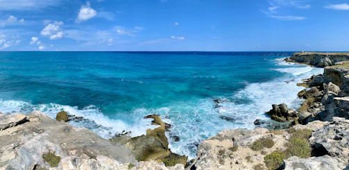 A panoramic view of the Amalfi Coast with cliffs and turquoise sea.
