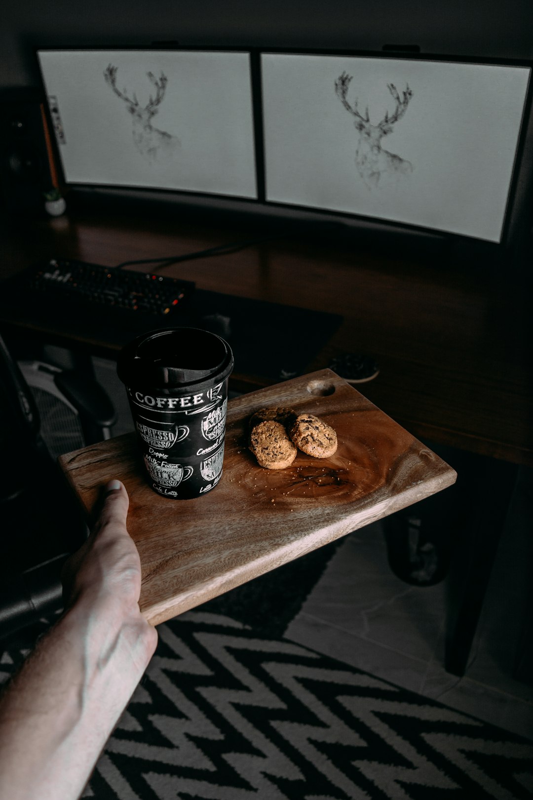 black and white ceramic mug on brown wooden chopping board