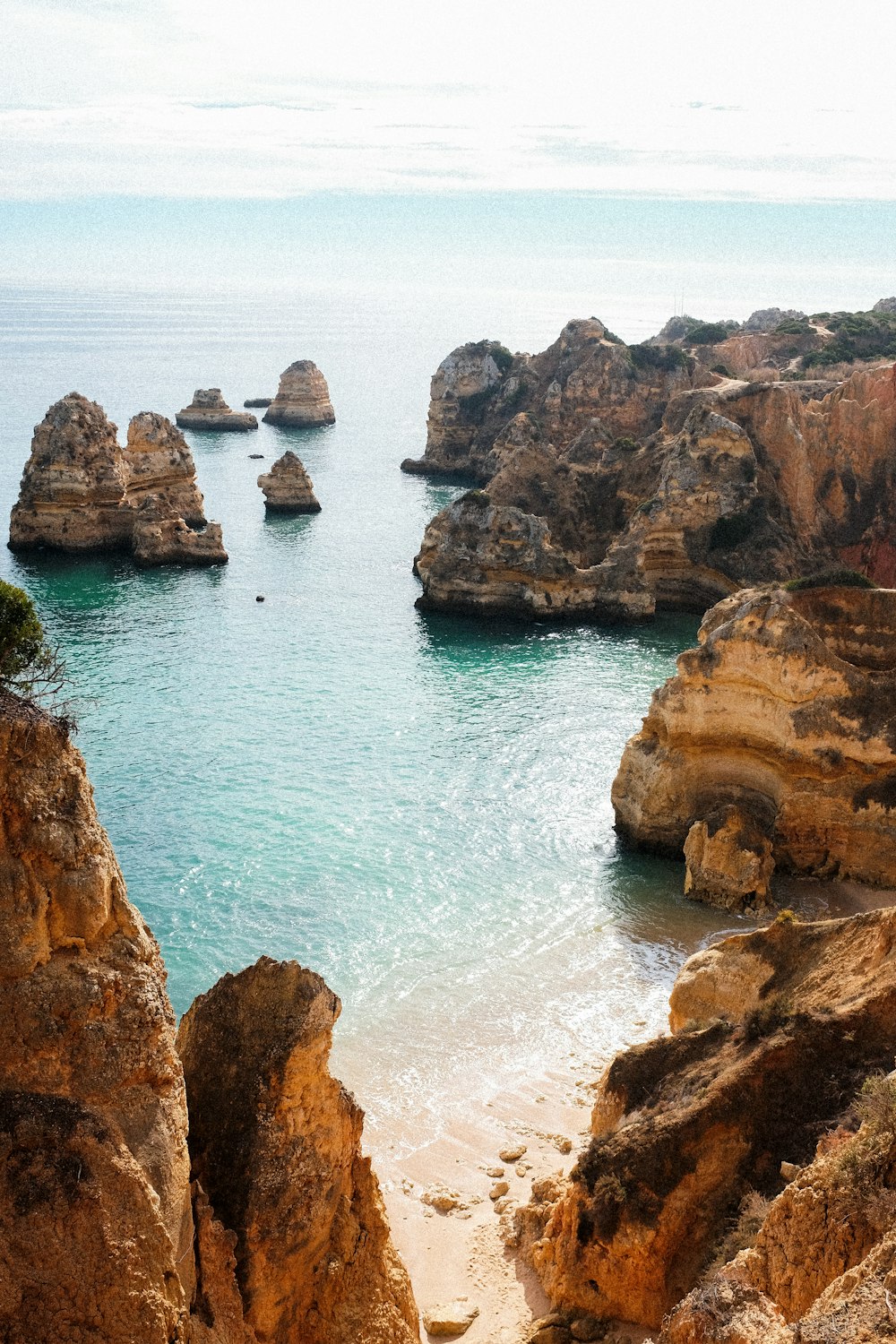 brown rock formation on sea during daytime