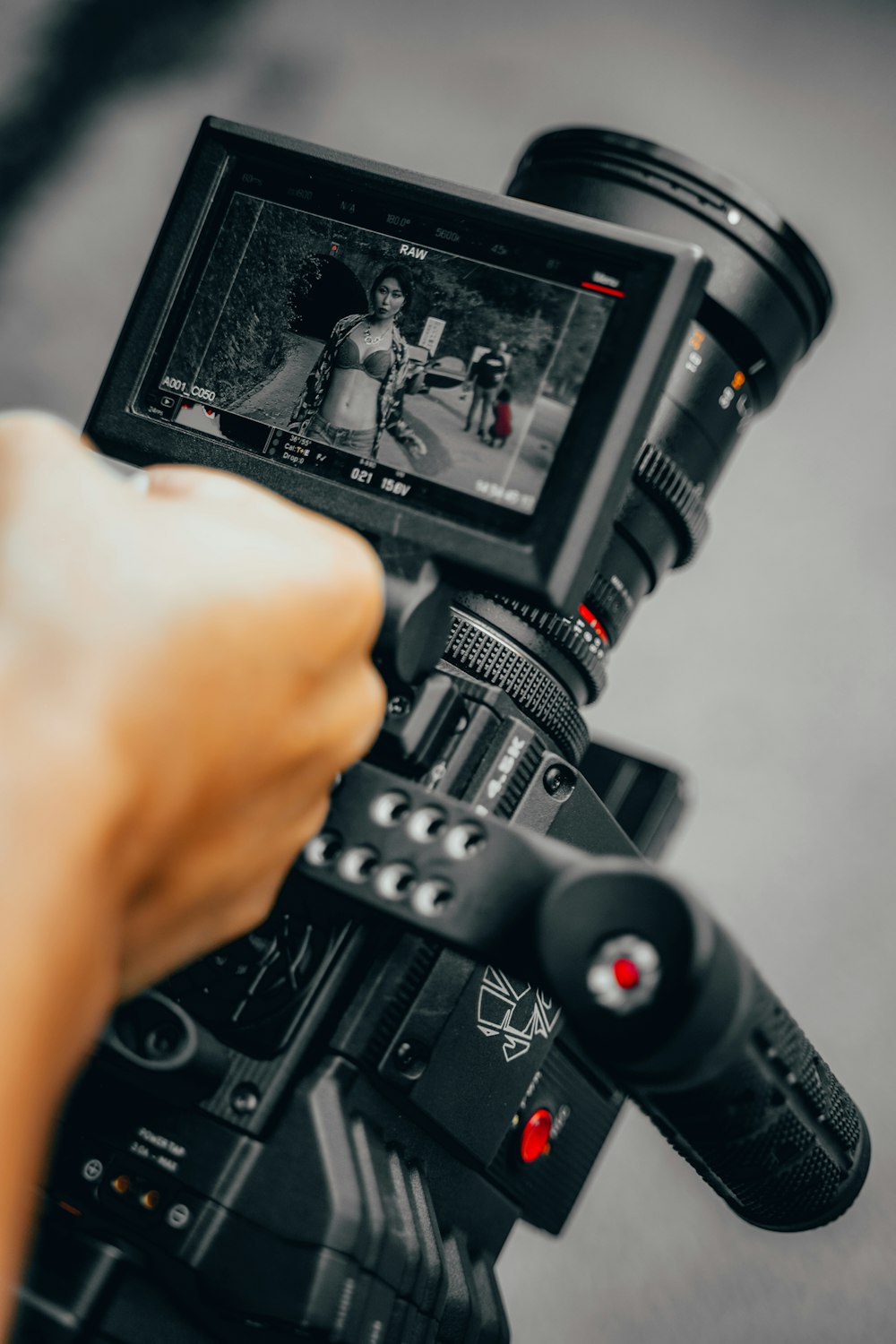 person holding black dslr camera