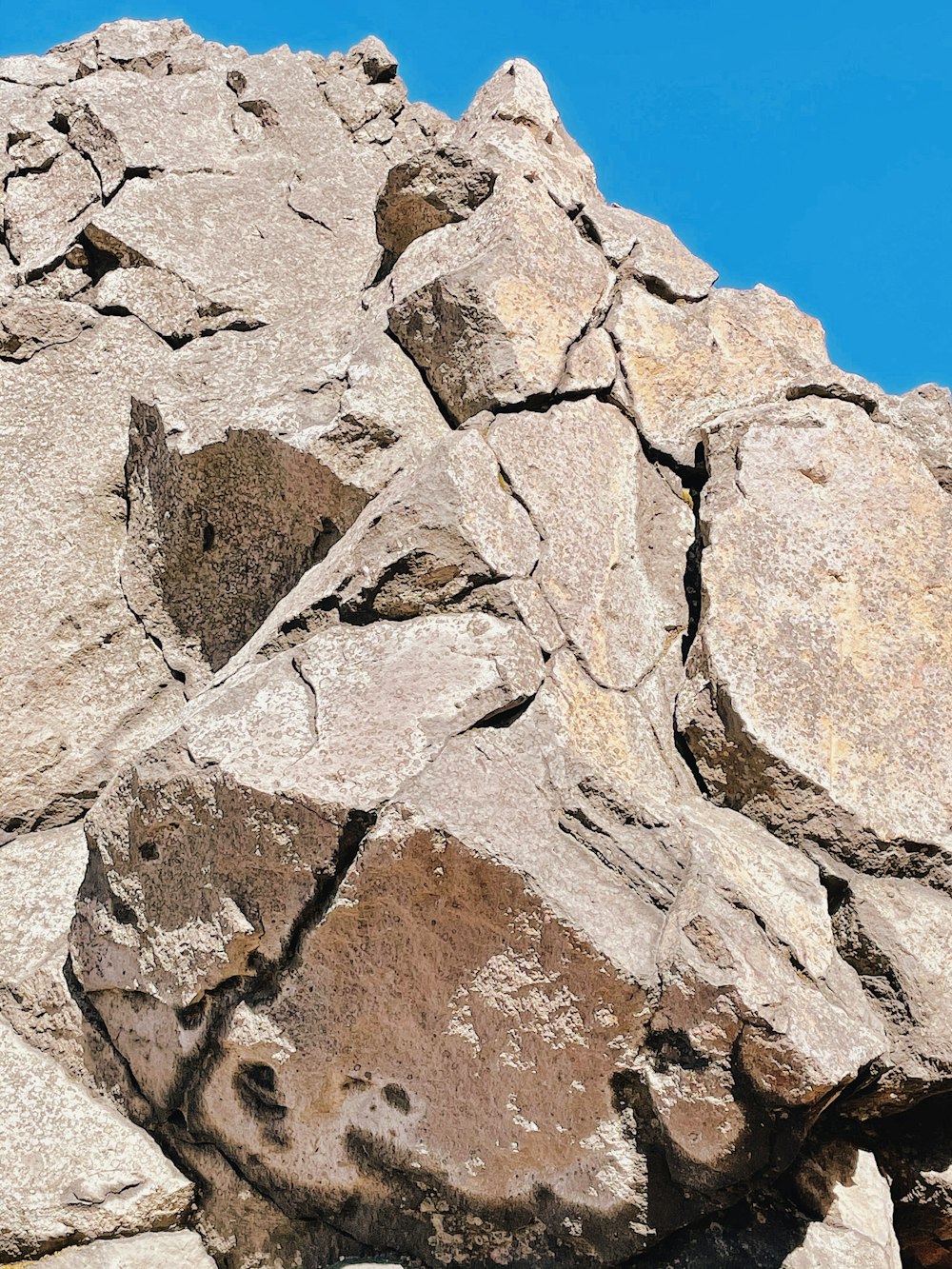 brown and gray rock formation under blue sky during daytime