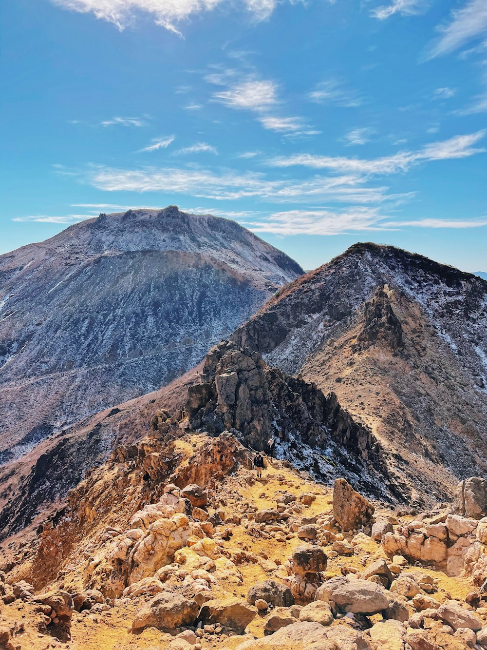 brown rocky mountain under blue sky during daytime