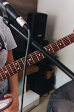 Close-up of a guitar and microphone ready for a live music session.