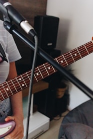 Close-up of a guitar and microphone ready for a live music session.