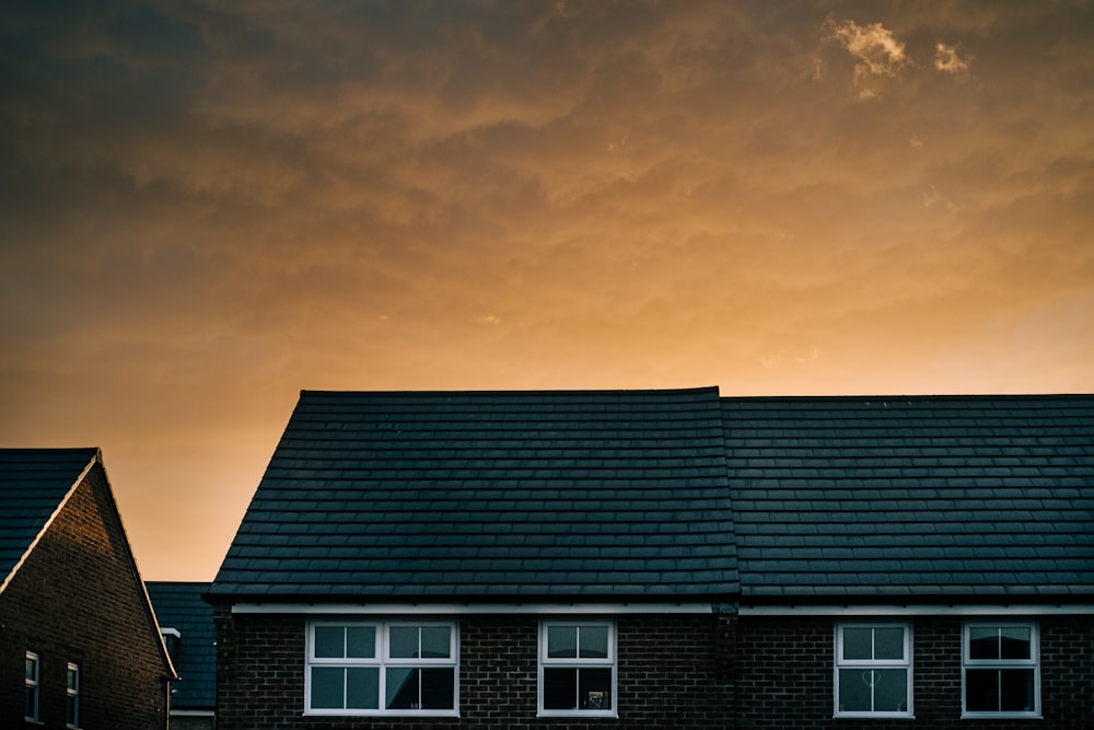 white and black house under gray sky