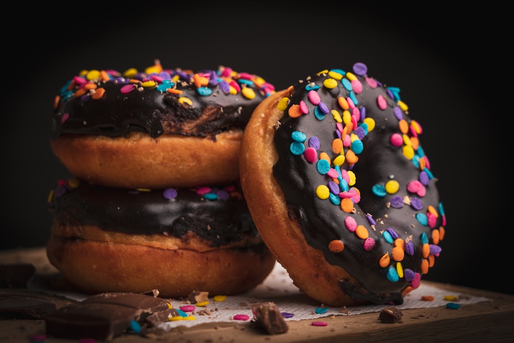 brown and black donuts on white and blue textile