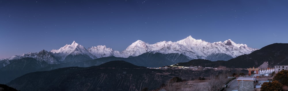 snow covered mountain under blue sky during daytime