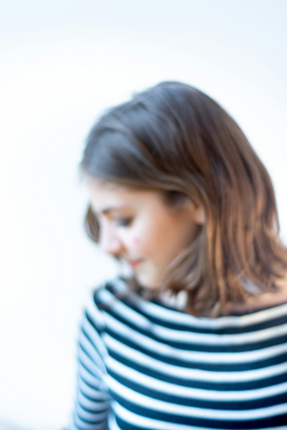 woman in black and white striped shirt