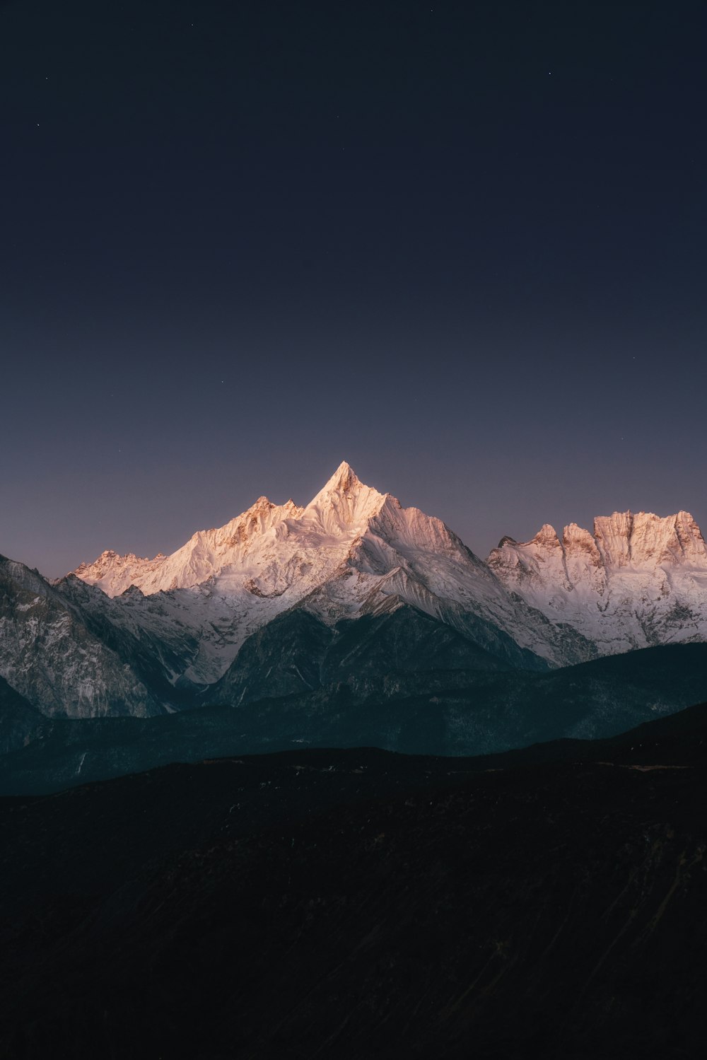 snow covered mountain during daytime