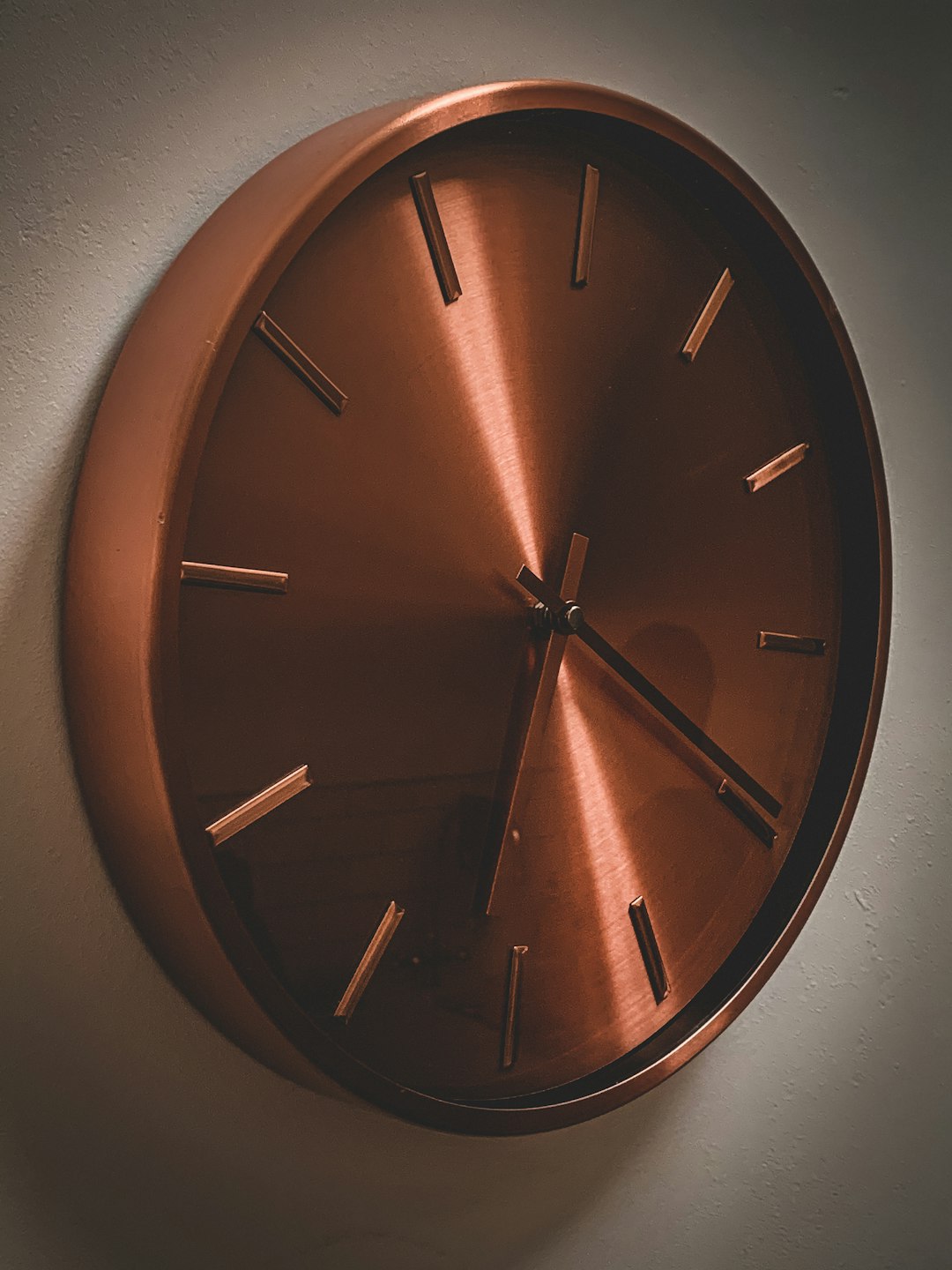 brown wooden round analog wall clock