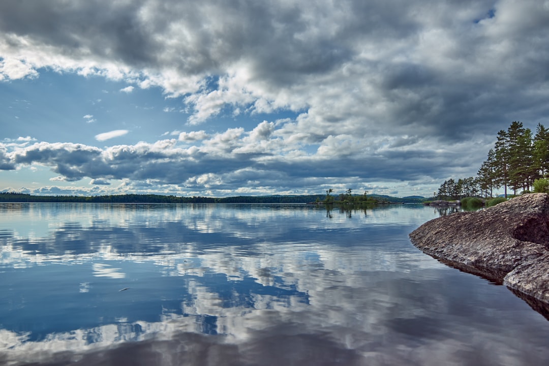 body of water under cloudy sky during daytime