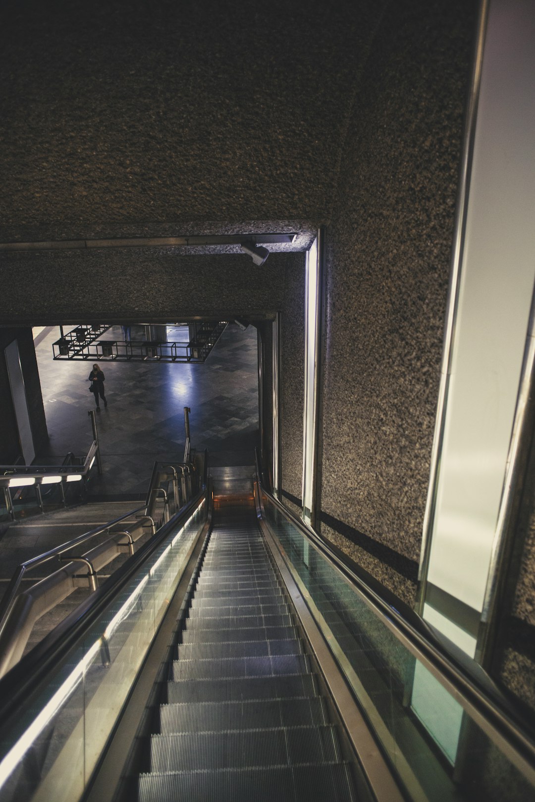 black and silver escalator in a room
