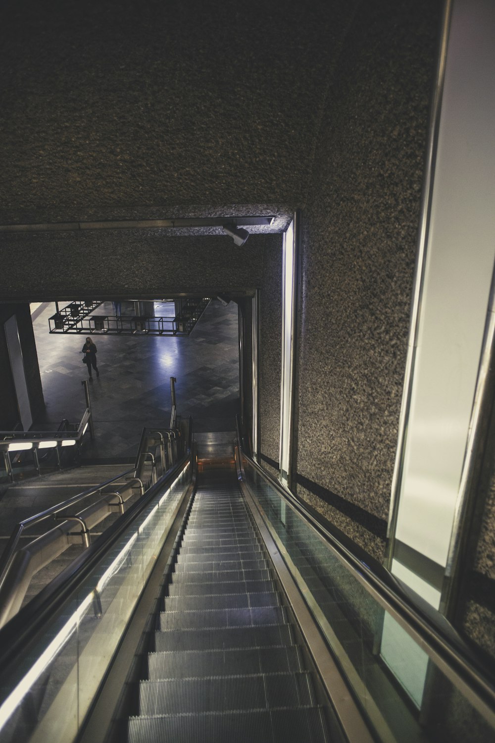 black and silver escalator in a room
