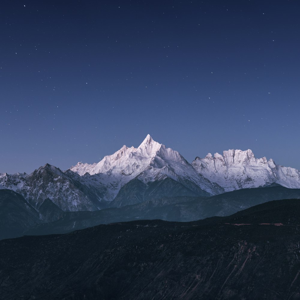 snow covered mountain under blue sky during daytime