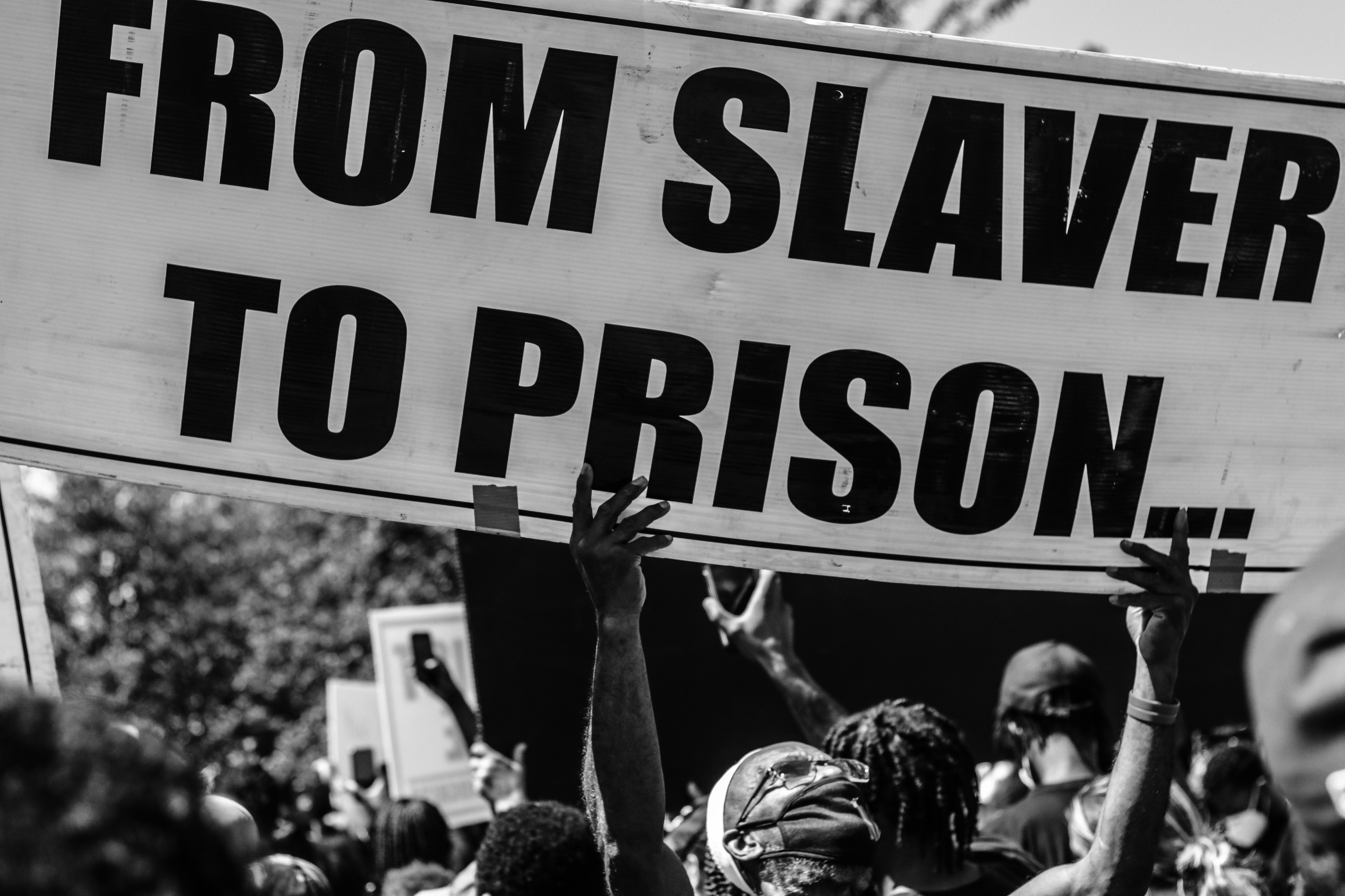 Grayscale photo of people holding a signage photo – Free Protest Image ...