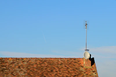 brown brick wall under blue sky during daytime