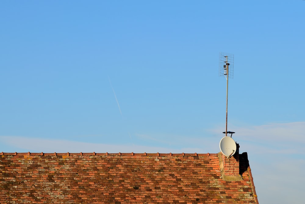 brown brick wall under blue sky during daytime