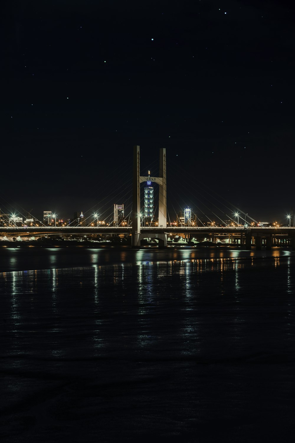 lighted bridge during night time