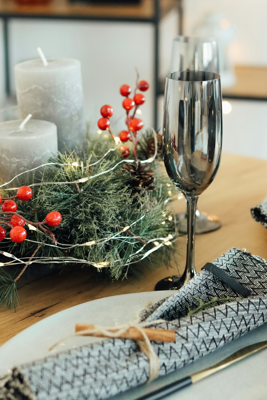 clear wine glass beside green christmas tree