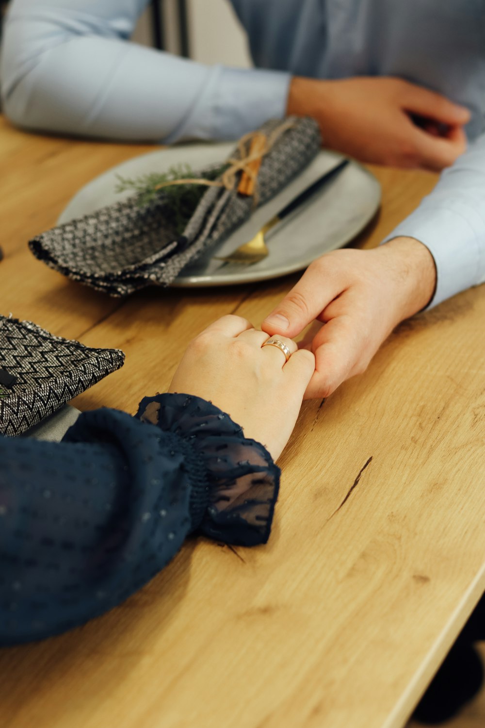 person in blue gloves holding silver fork