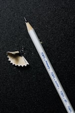 A close-up of a TEF Canada test booklet and a pen on a desk.