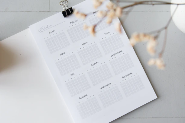 A colorful calendar marked with Spanish class dates, accented with magenta and cyan highlights.