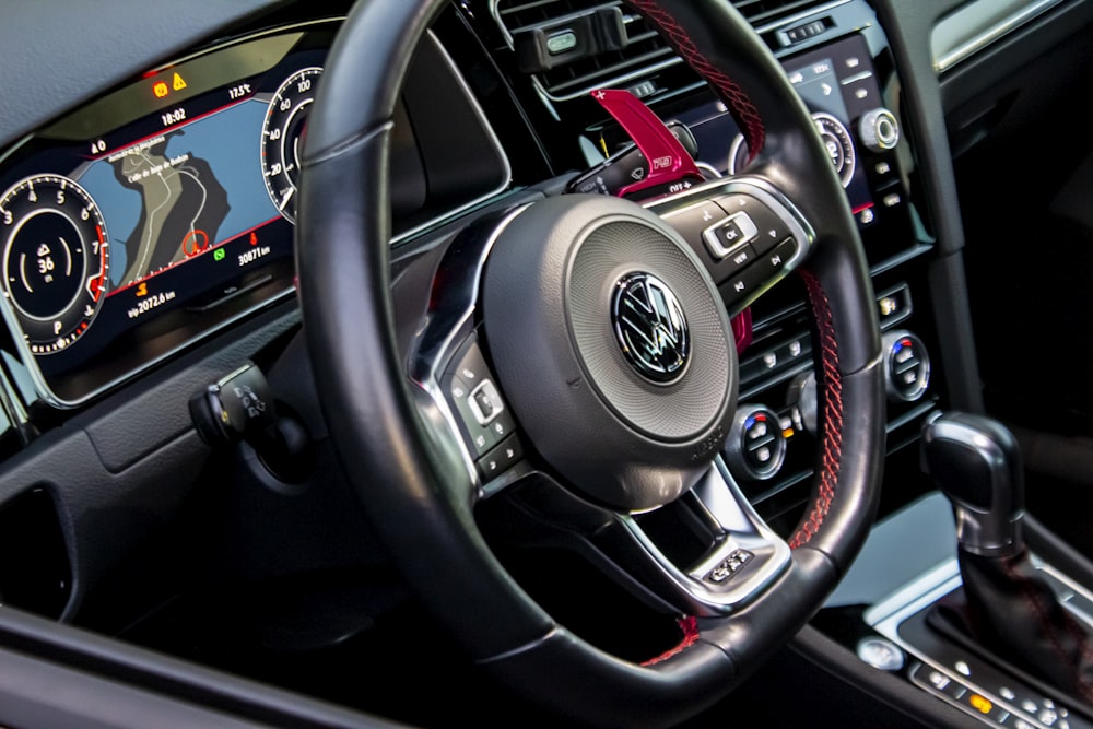 black and silver mercedes benz steering wheel