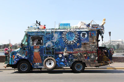 A vibrant art car decorated with lights cruising through the playa.