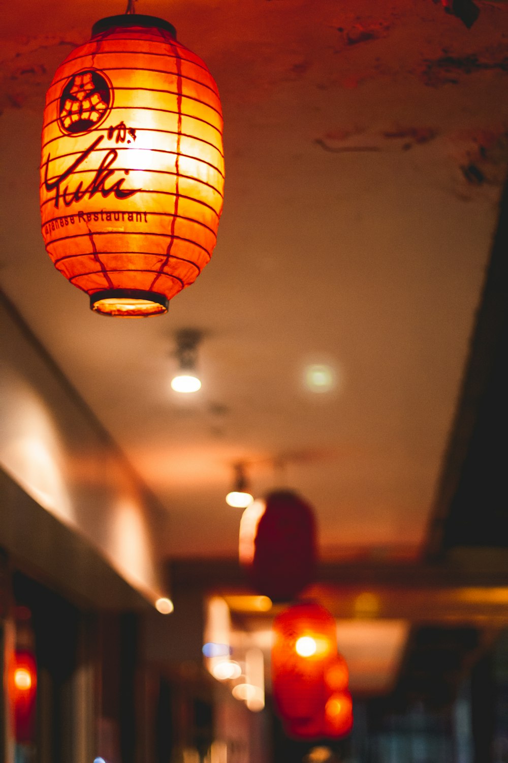 yellow paper lantern on white ceiling