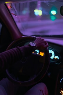 person driving car during daytime