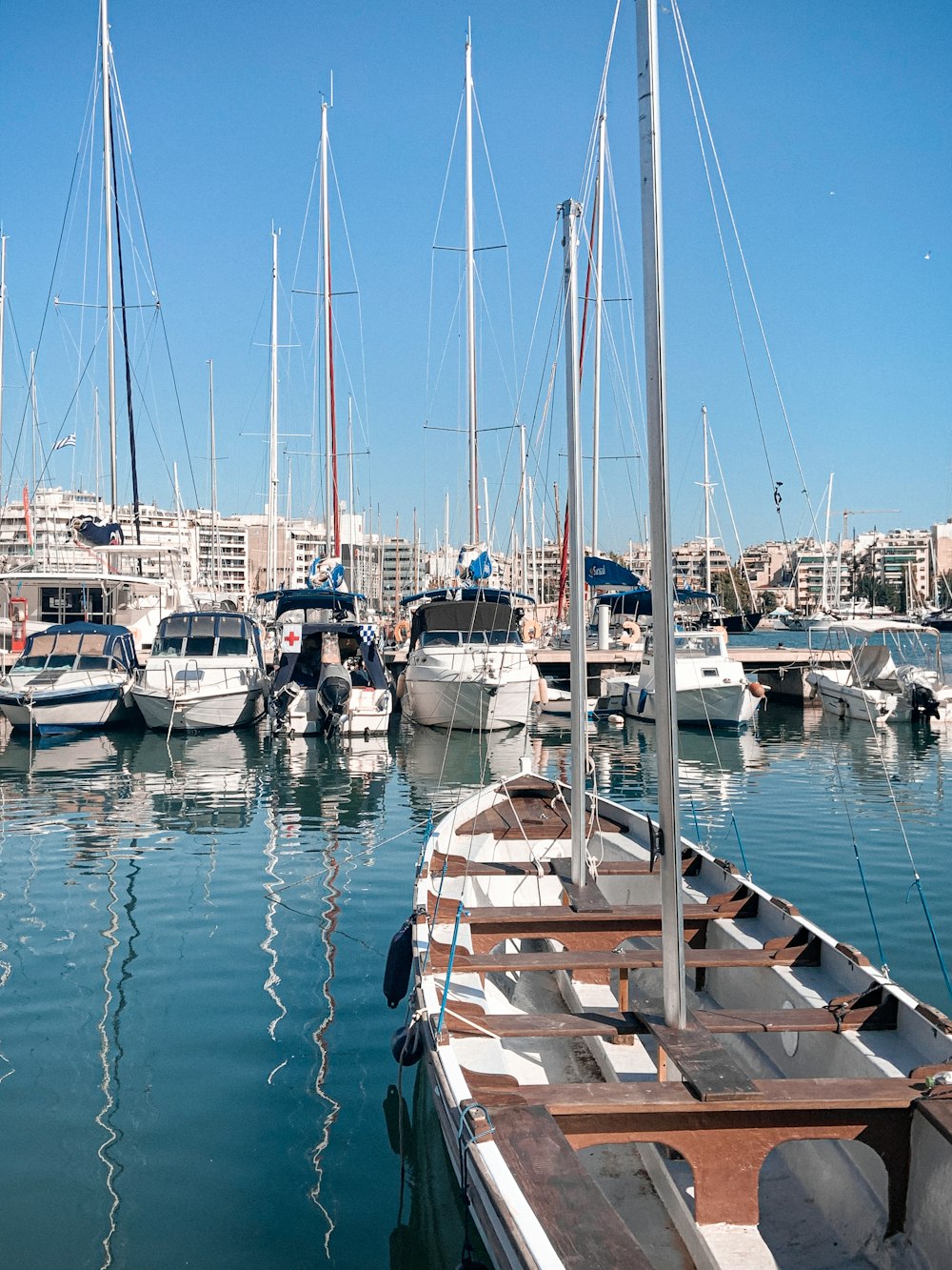 white and brown boat on dock during daytime