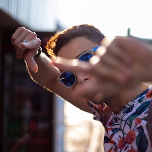 A playful snapshot of Nosy Rosy mid-commentary with expressive hand gestures.