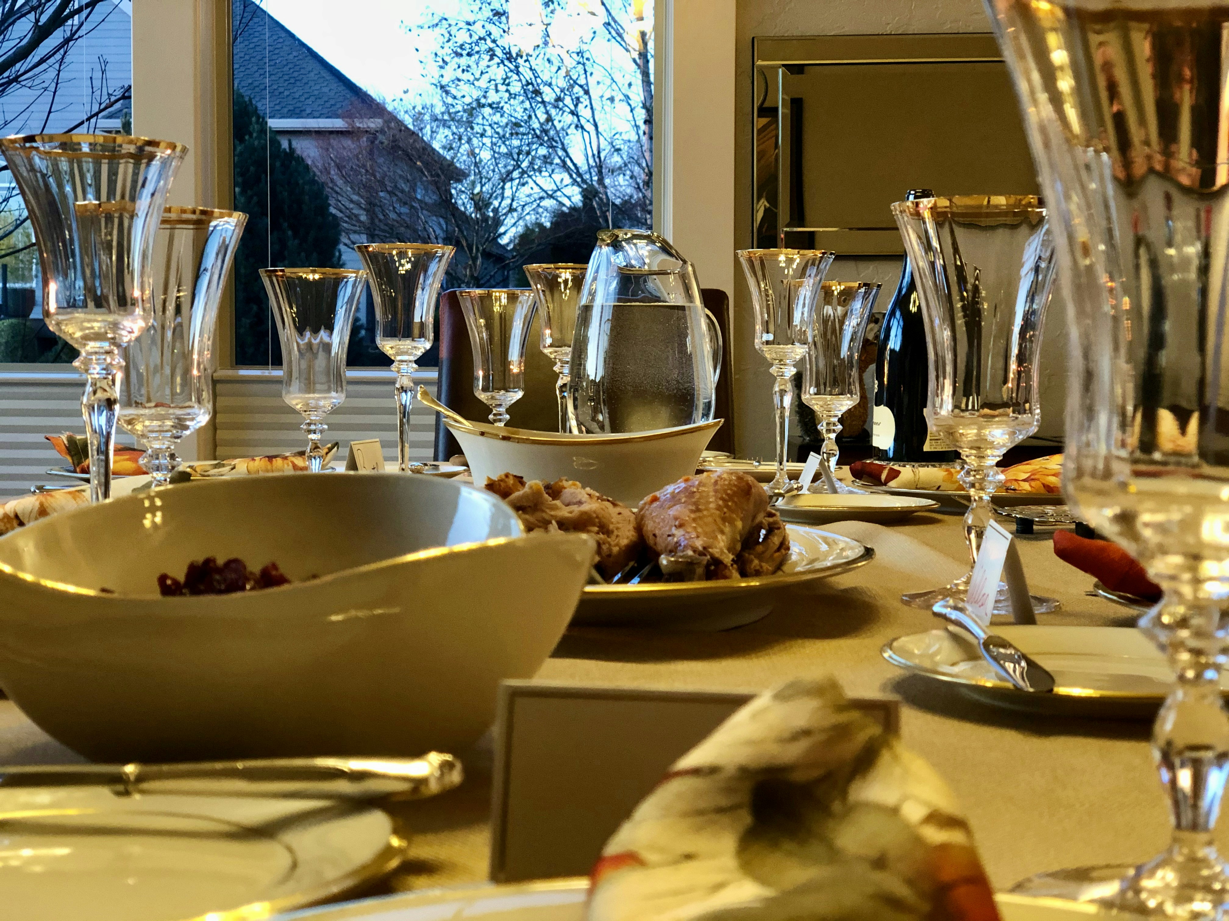 Fine dining table setting with crystal glasses and polished cutlery