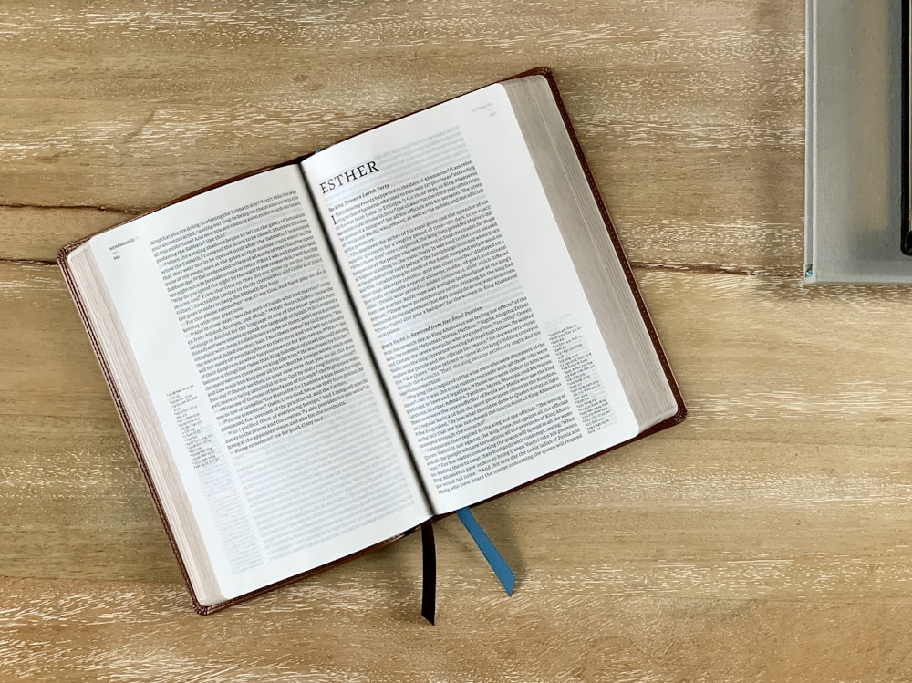 white book page on brown wooden table