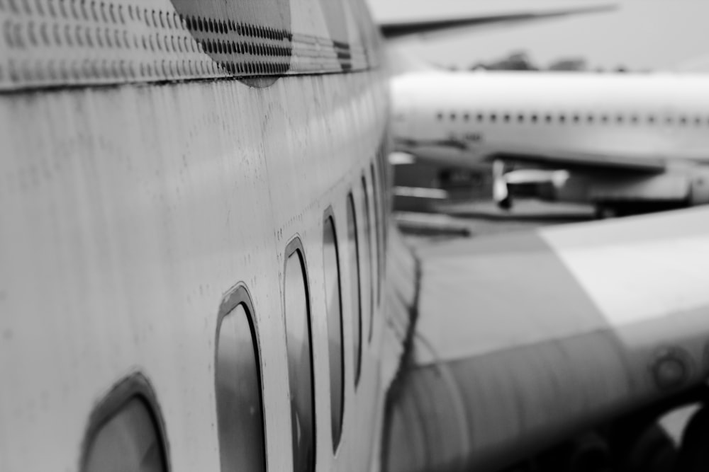 grayscale photo of airplane door