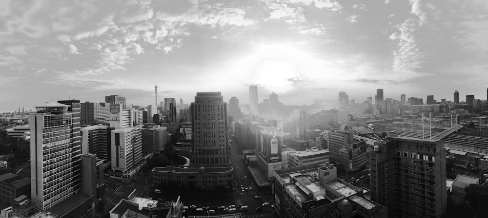 grayscale photo of city buildings