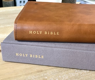 brown leather book on brown wooden table