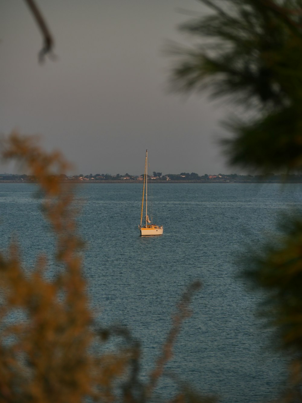 white boat on body of water during daytime