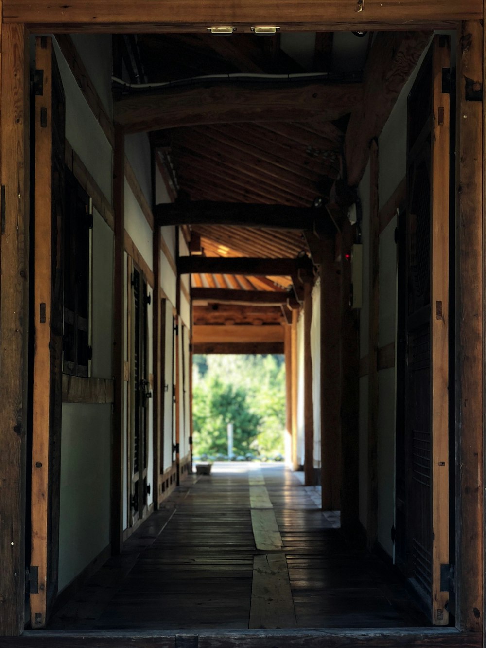 brown wooden hallway during daytime