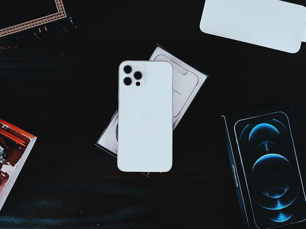 white iphone case on black table