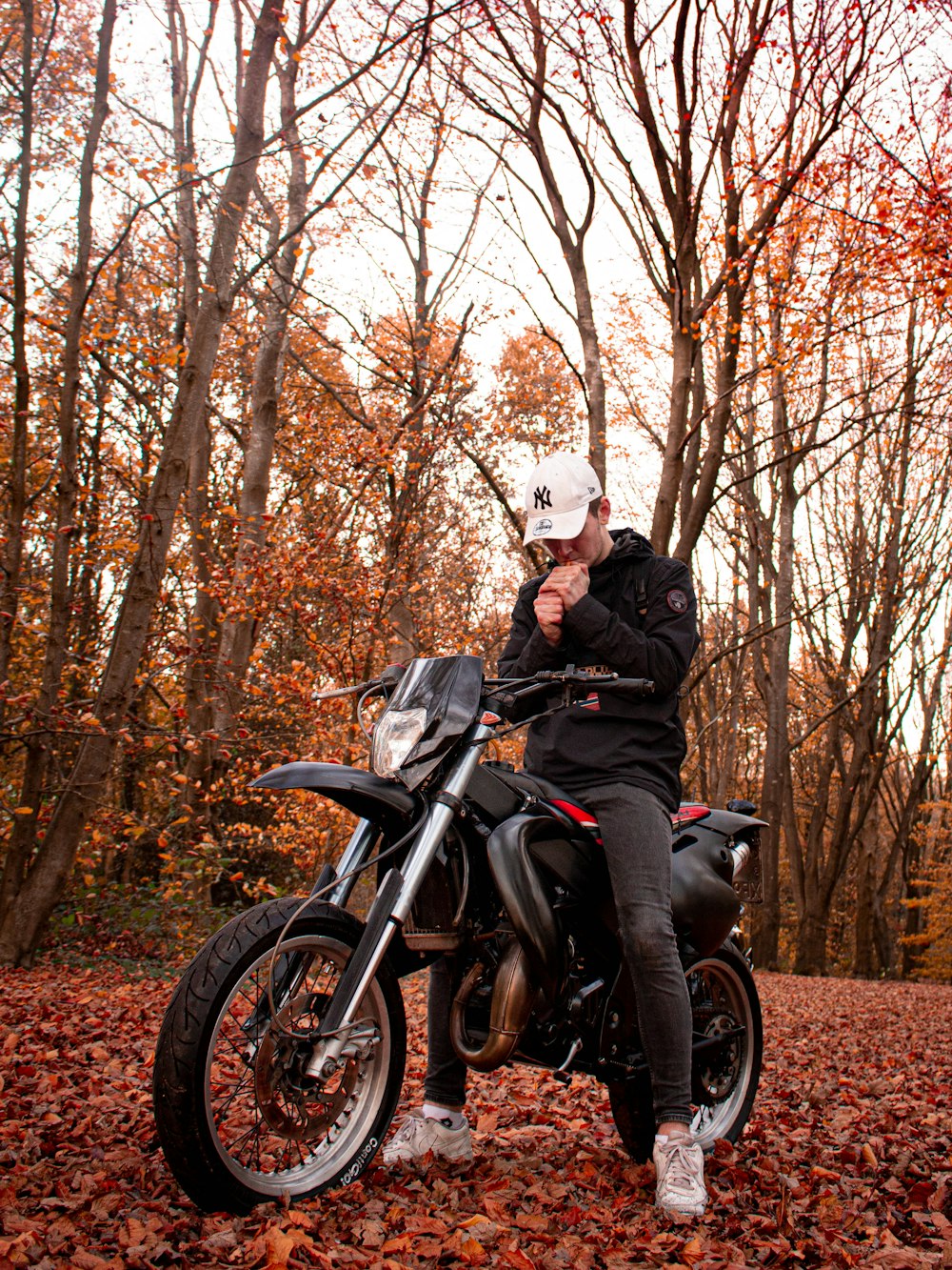 man in black jacket riding black motorcycle