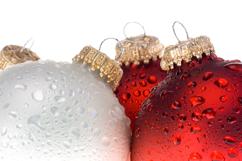 red and gold baubles on white background