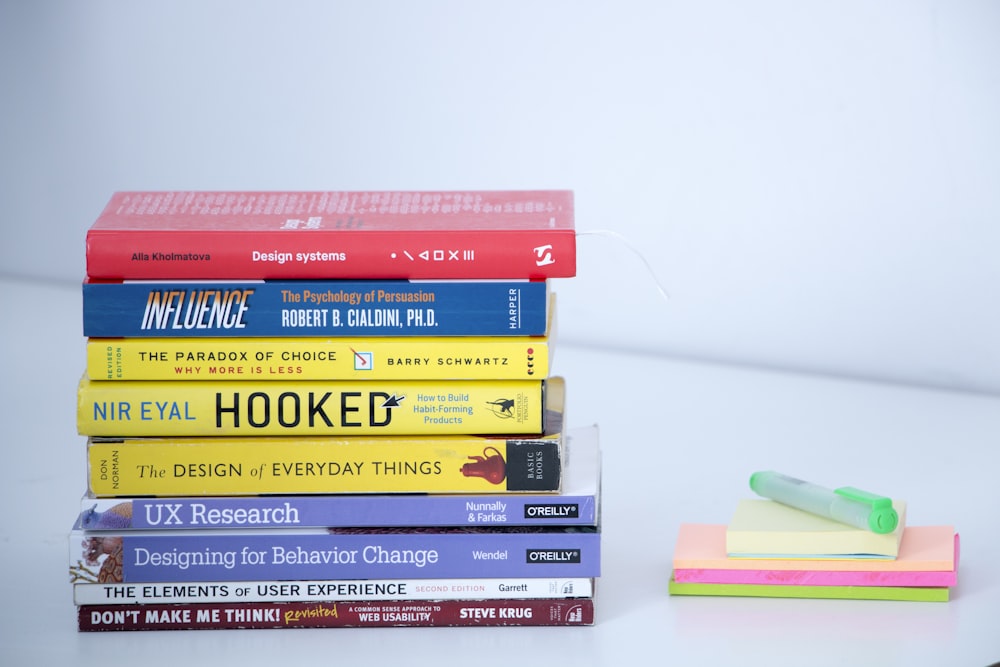 assorted books on white table