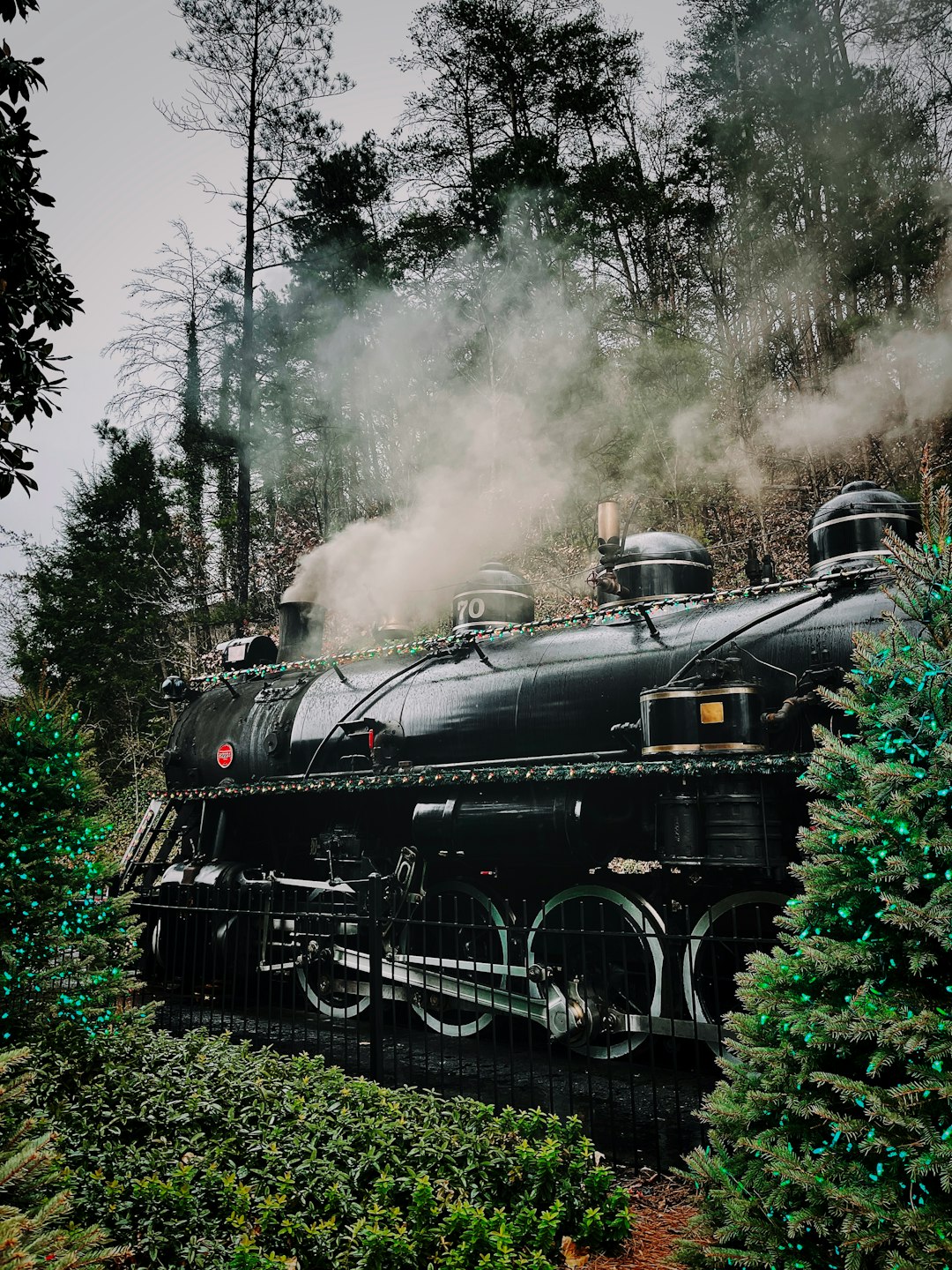 black train on rail tracks during daytime