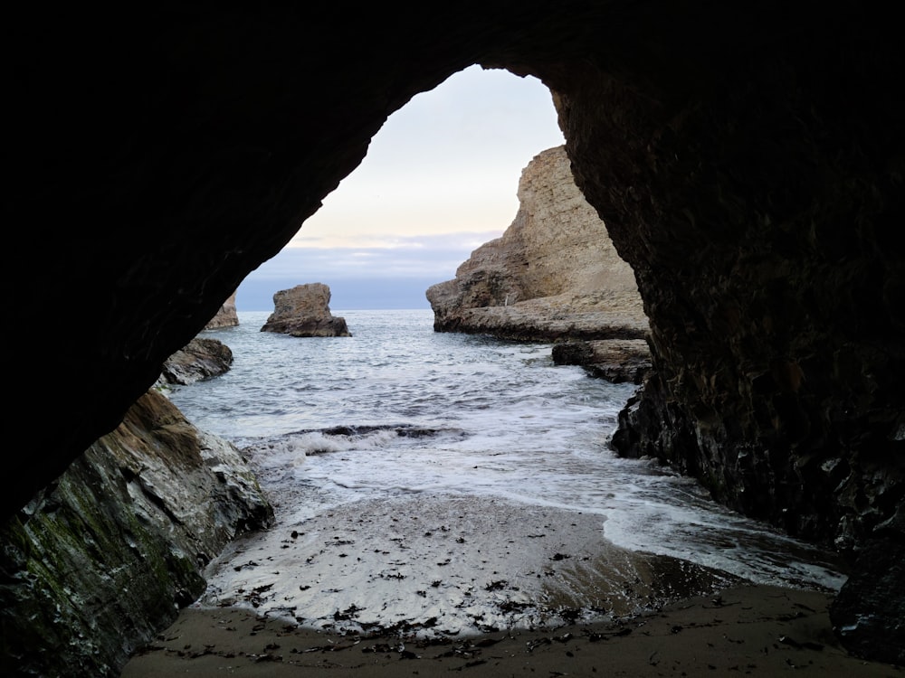 brown rock formation on sea during daytime