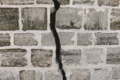 white and gray brick wall brick repair