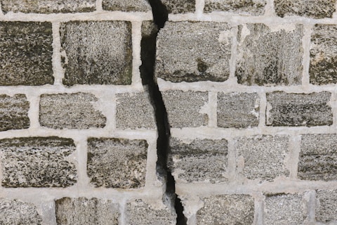 white and gray brick wall brick repair