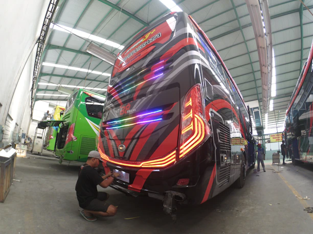 Before and after shots of a heavy-duty bus cleaned and polished by Au Nationwide Detailing.