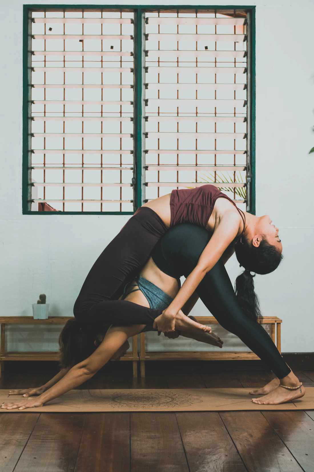 A woman stretching on a yoga mat